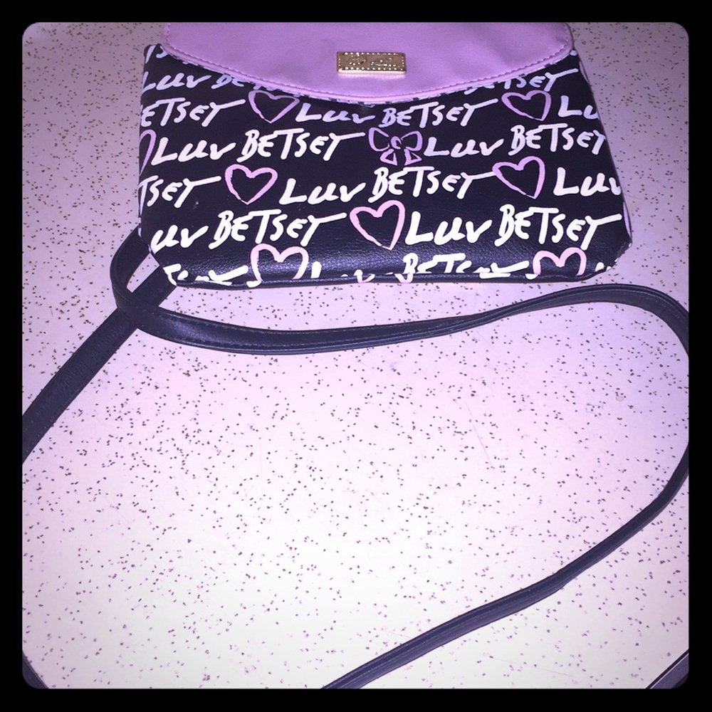 A pink and white mini travel Betsy purse